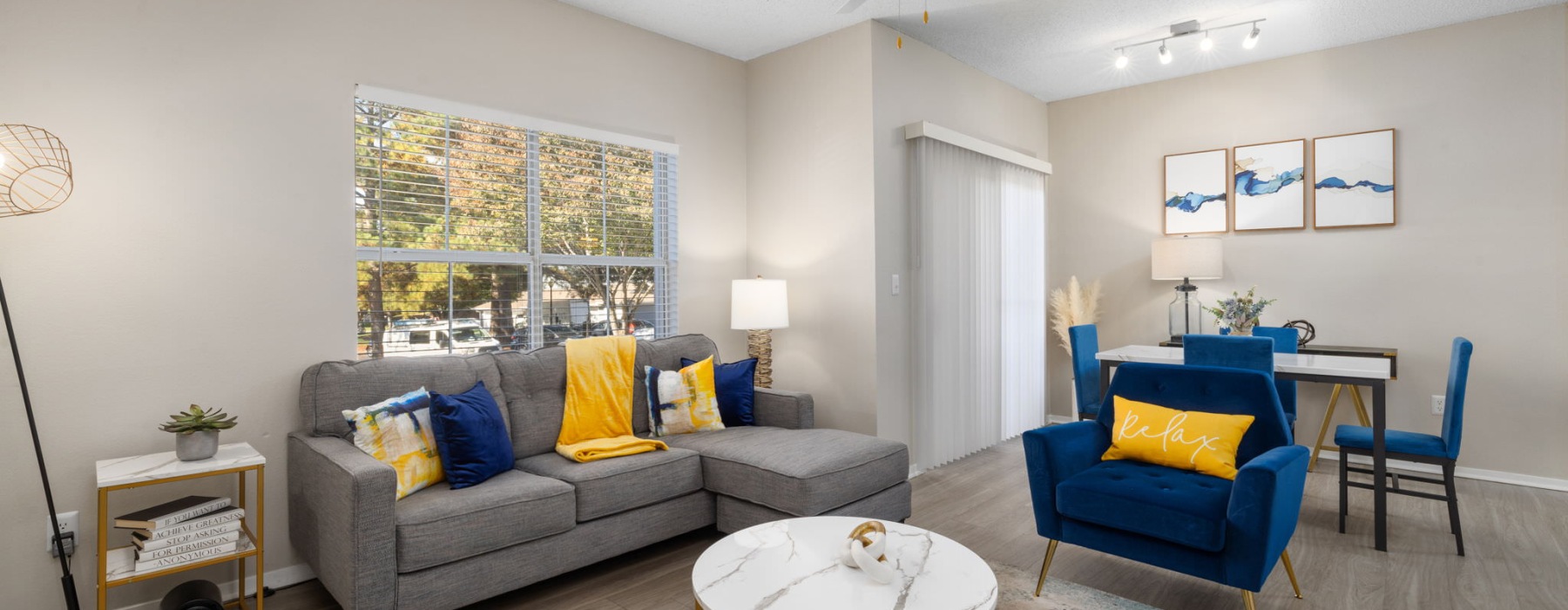 living area with a table, chair, and couch
