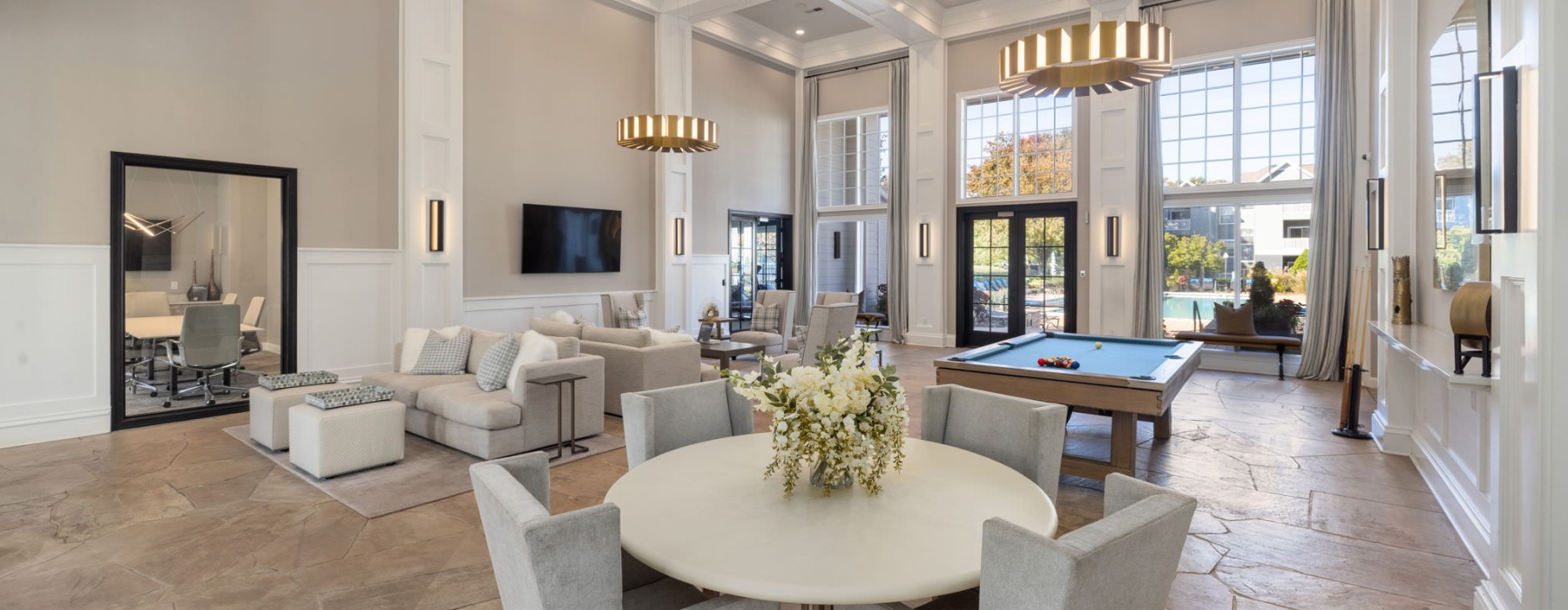 a large room with a table and chairs