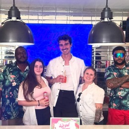 a few people posing for a picture inside