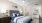 a bedroom with a bed and a lamp
