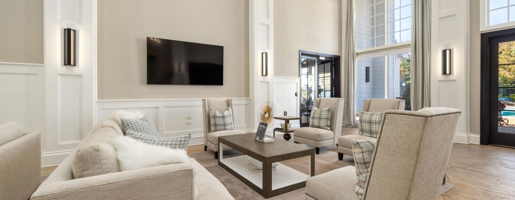 a club room with a tv and couches