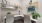 a room with a desk and chairs
