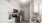 a kitchen with white cabinets