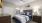 a bedroom with a bed and a table
