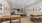a kitchen with a bar and chairs